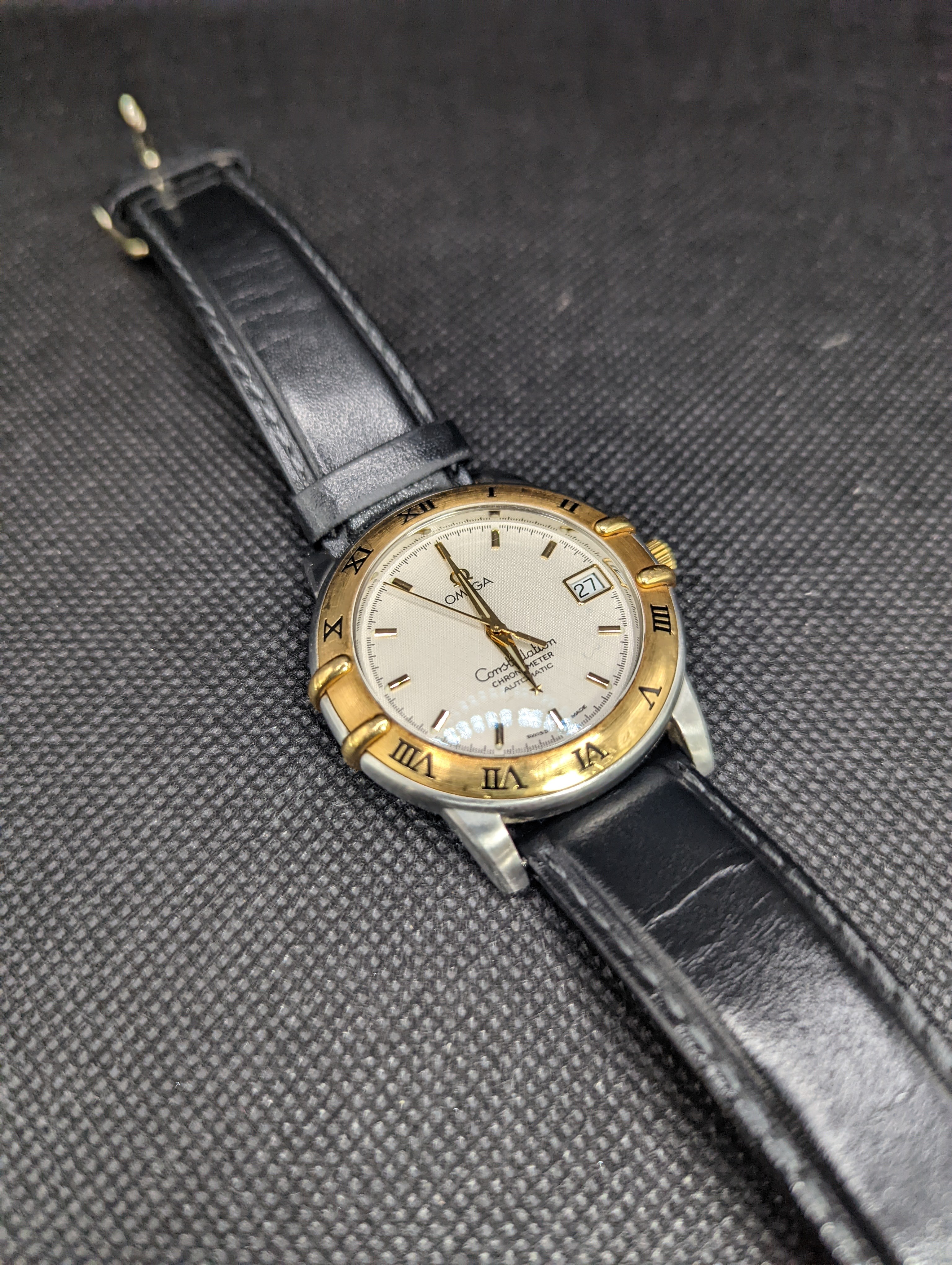 A gentleman's stainless steel and gold plated Omega Constellation Automatic wrist watch, on associated leather strap, case diameter 36mm